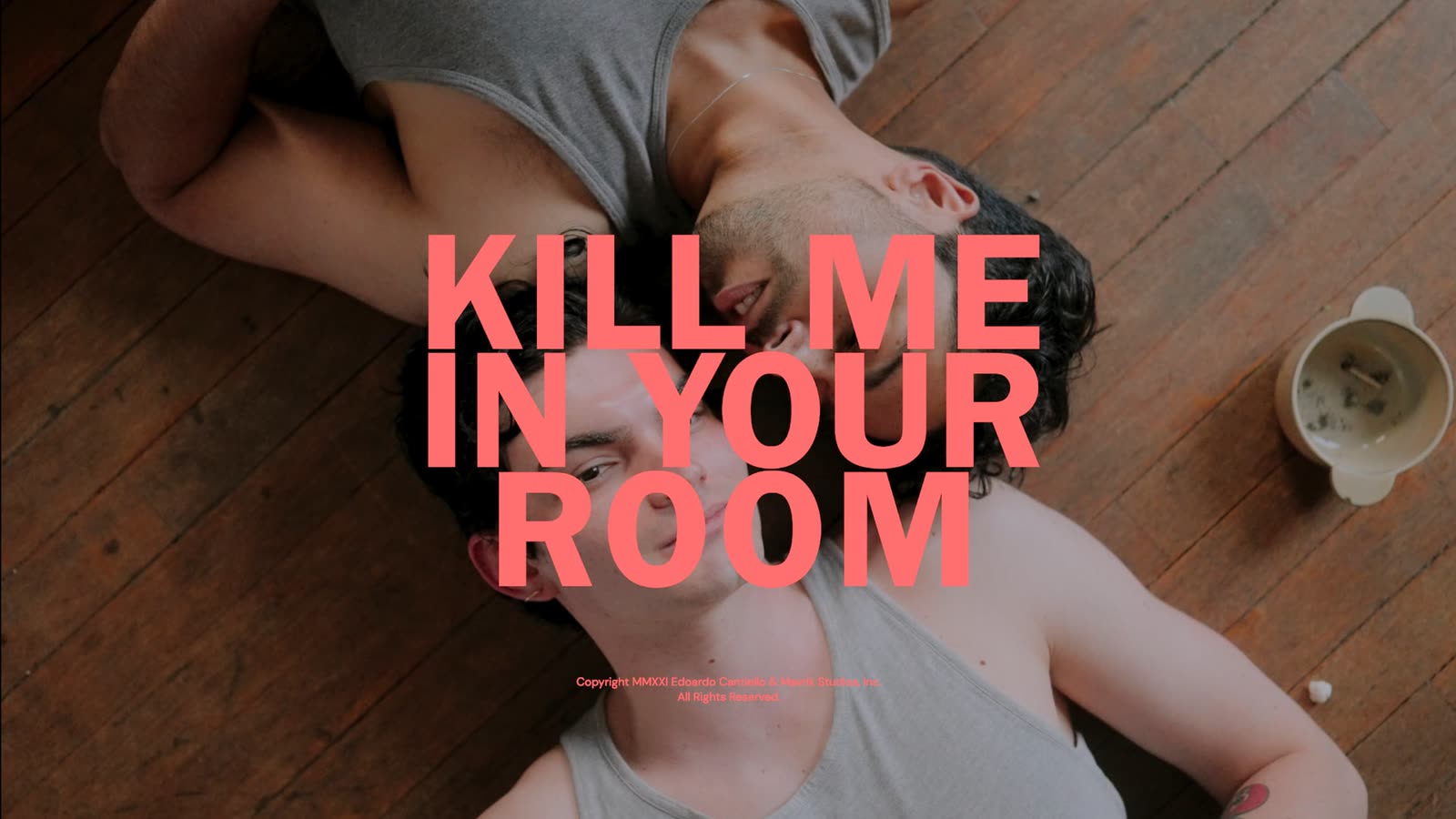 Two men lying on a wooden floor, the title Kill Me in Your Room in pink over them